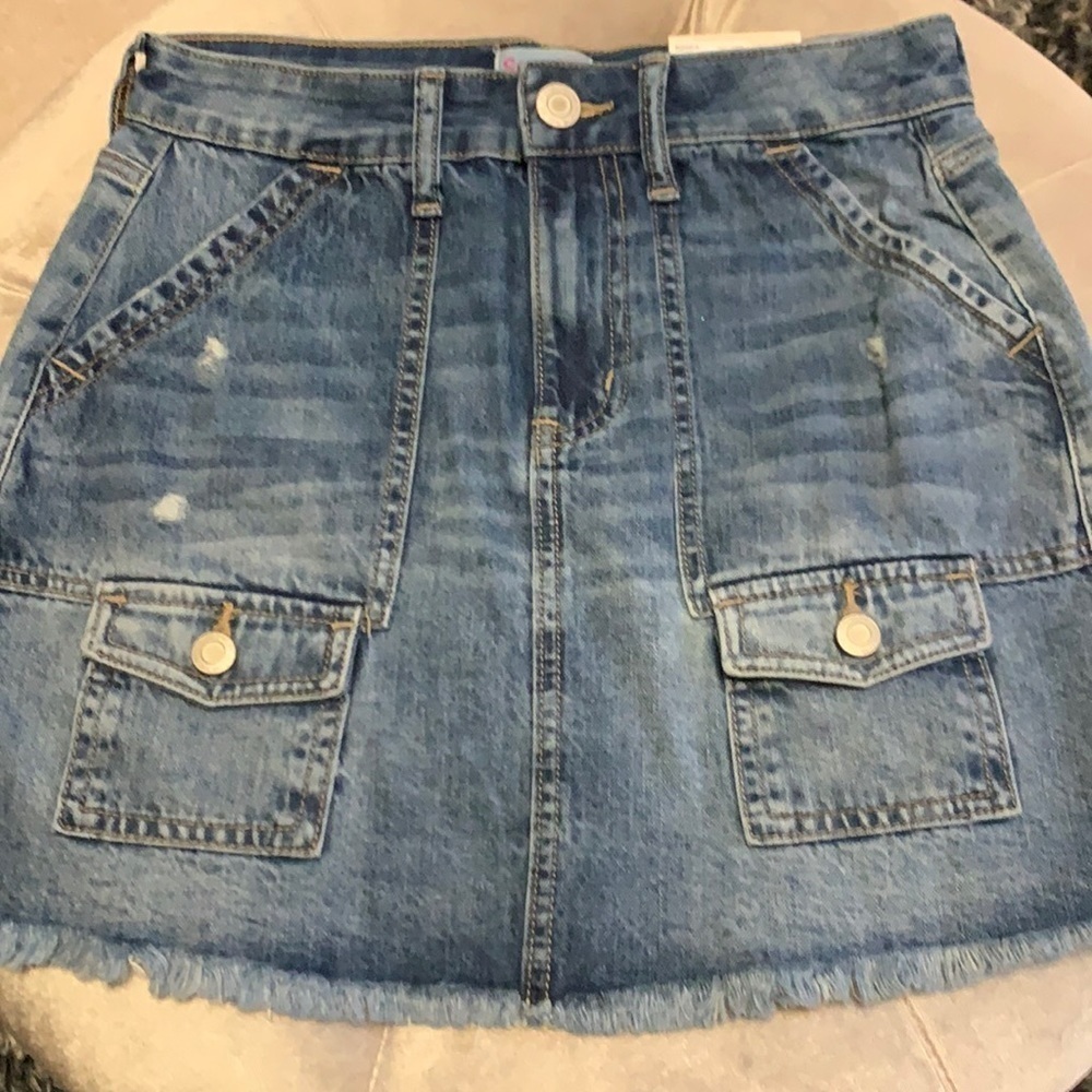 SO brand Jean skirt with pockets on the front and back, soft fringed hem